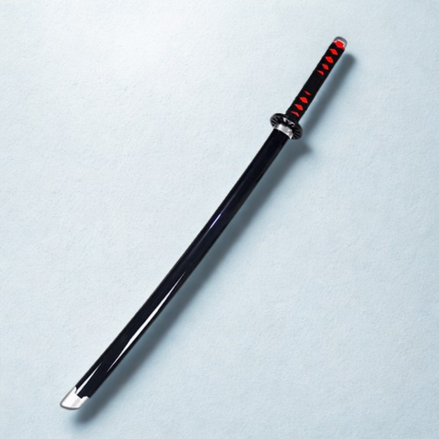 Close-up of Tanjiro’s serrated black blade with unique katana handle design