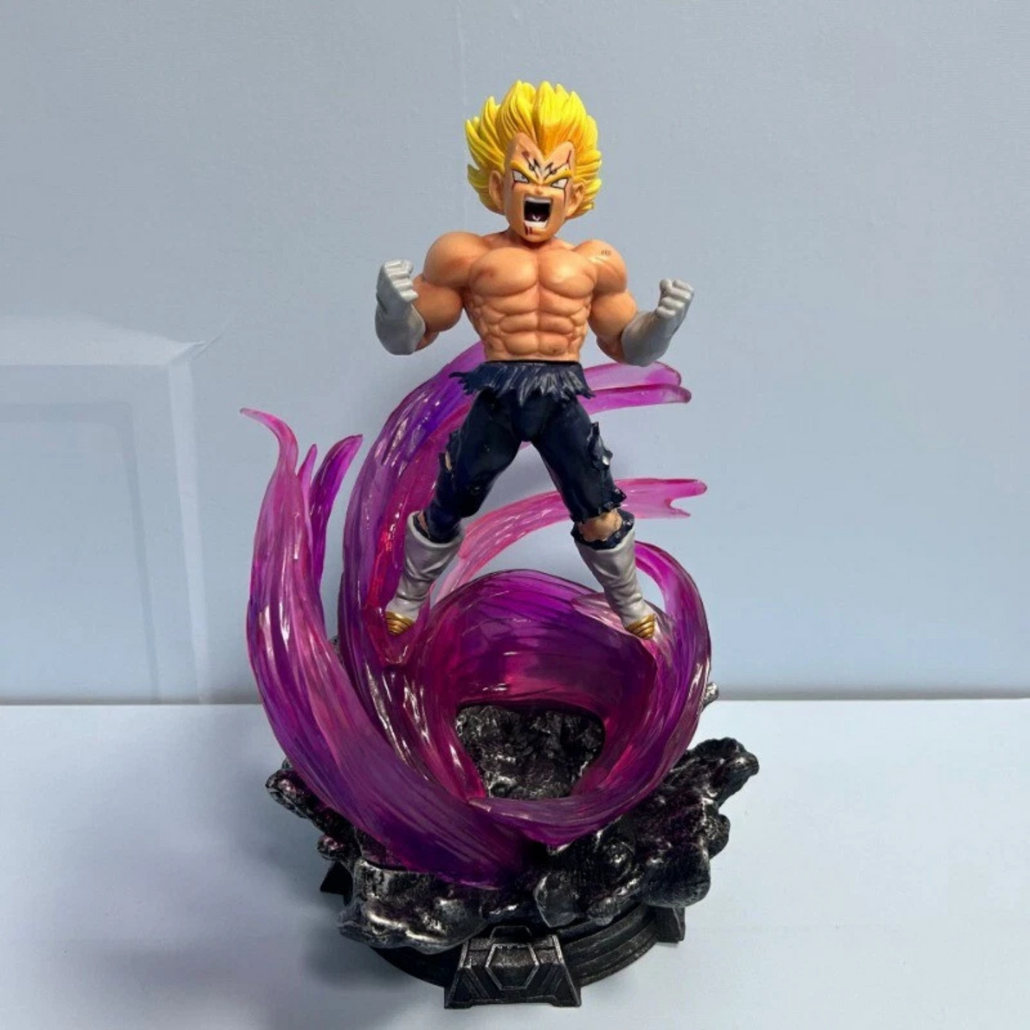 Dragon Ball Z action figure of Super Saiyan Ultra Instinct Vegeta with LED base, purple energy swirl, and interchangeable heads.