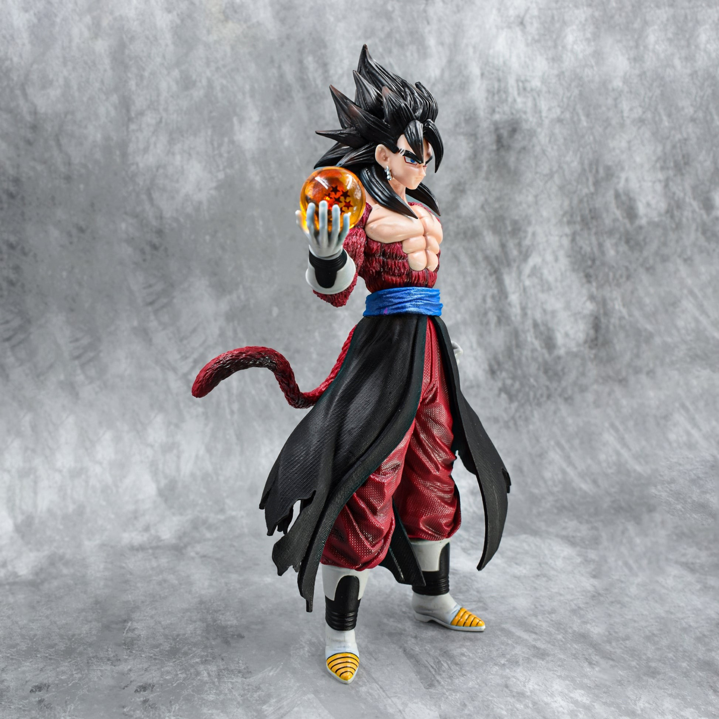 Super Saiyan 4 Goku collectible figure holding Dragon Ball