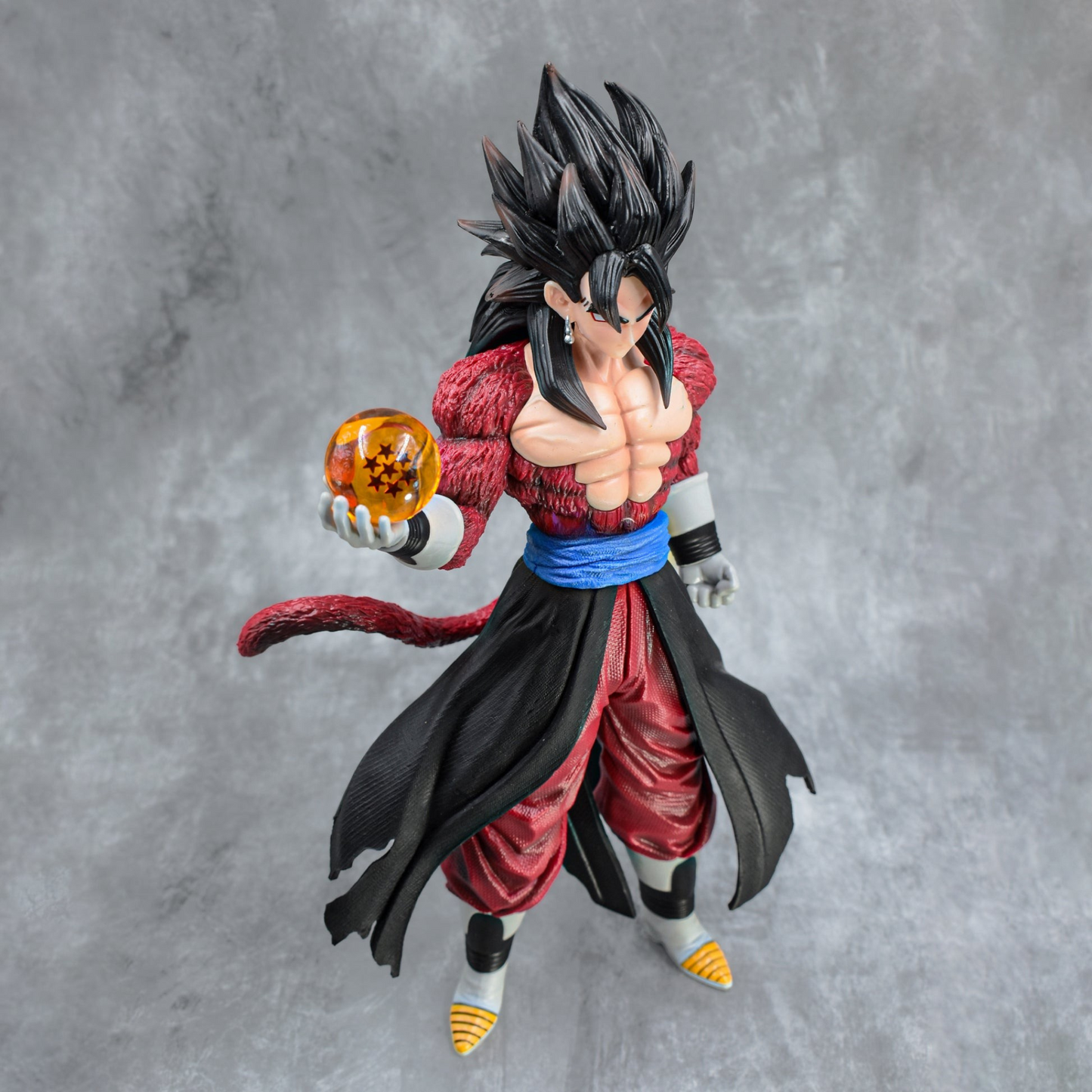 Super Saiyan 4 Goku collectible figure holding Dragon Ball