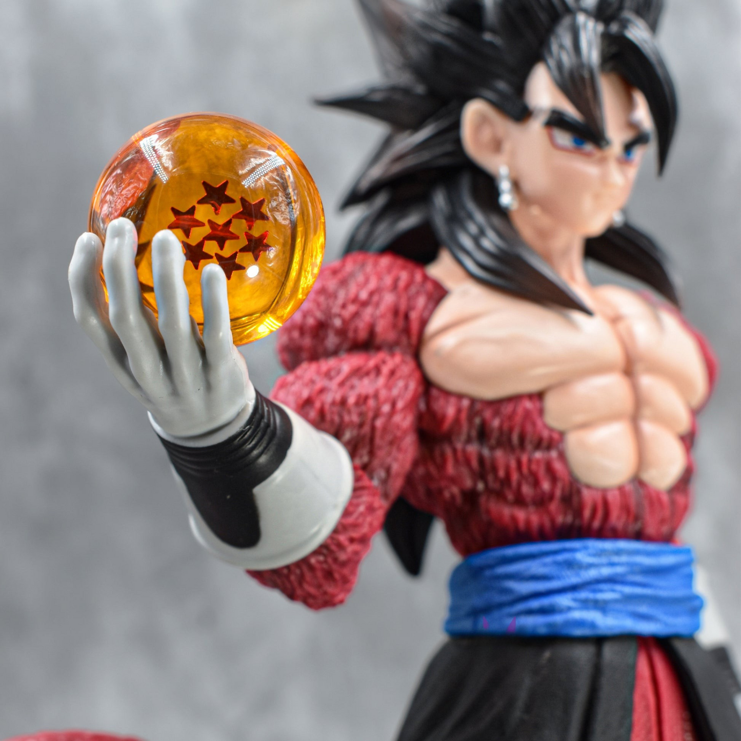 Super Saiyan 4 Goku collectible figure holding Dragon Ball