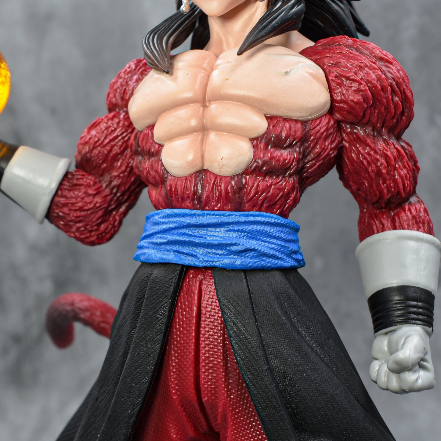 Super Saiyan 4 Goku collectible figure holding Dragon Ball