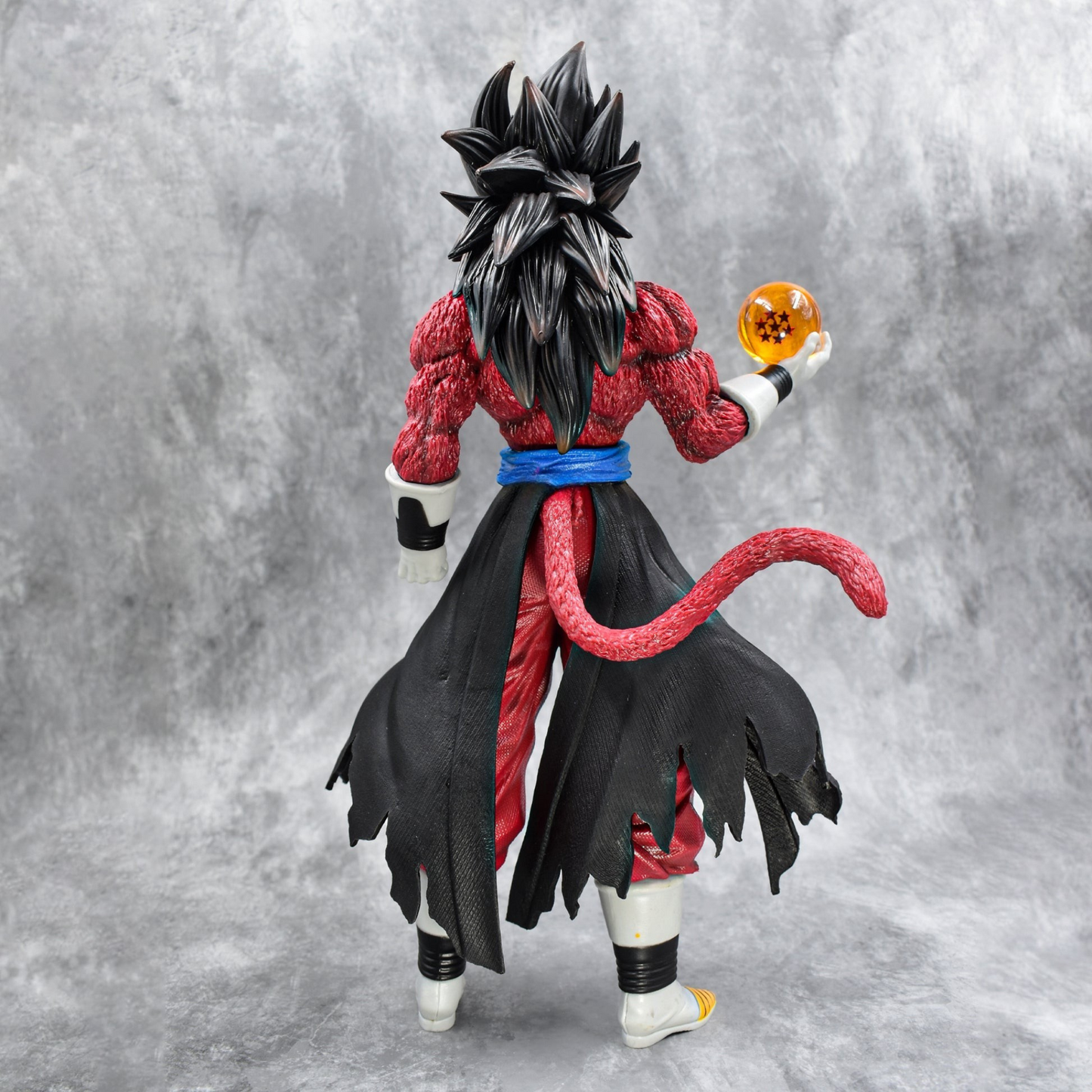 Super Saiyan 4 Goku collectible figure holding Dragon Ball