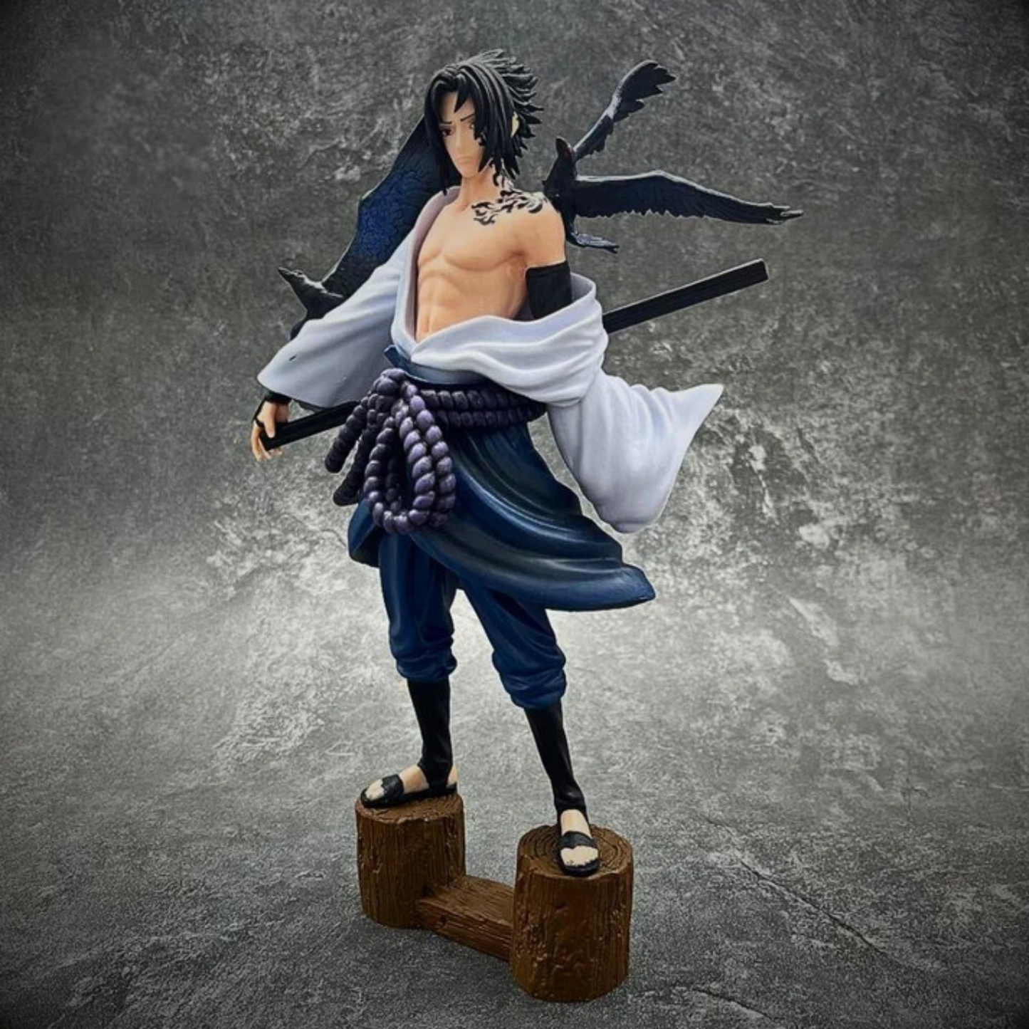 Sasuke Uchiha 30 cm action figure in Shippuden outfit with sword and intense gaze