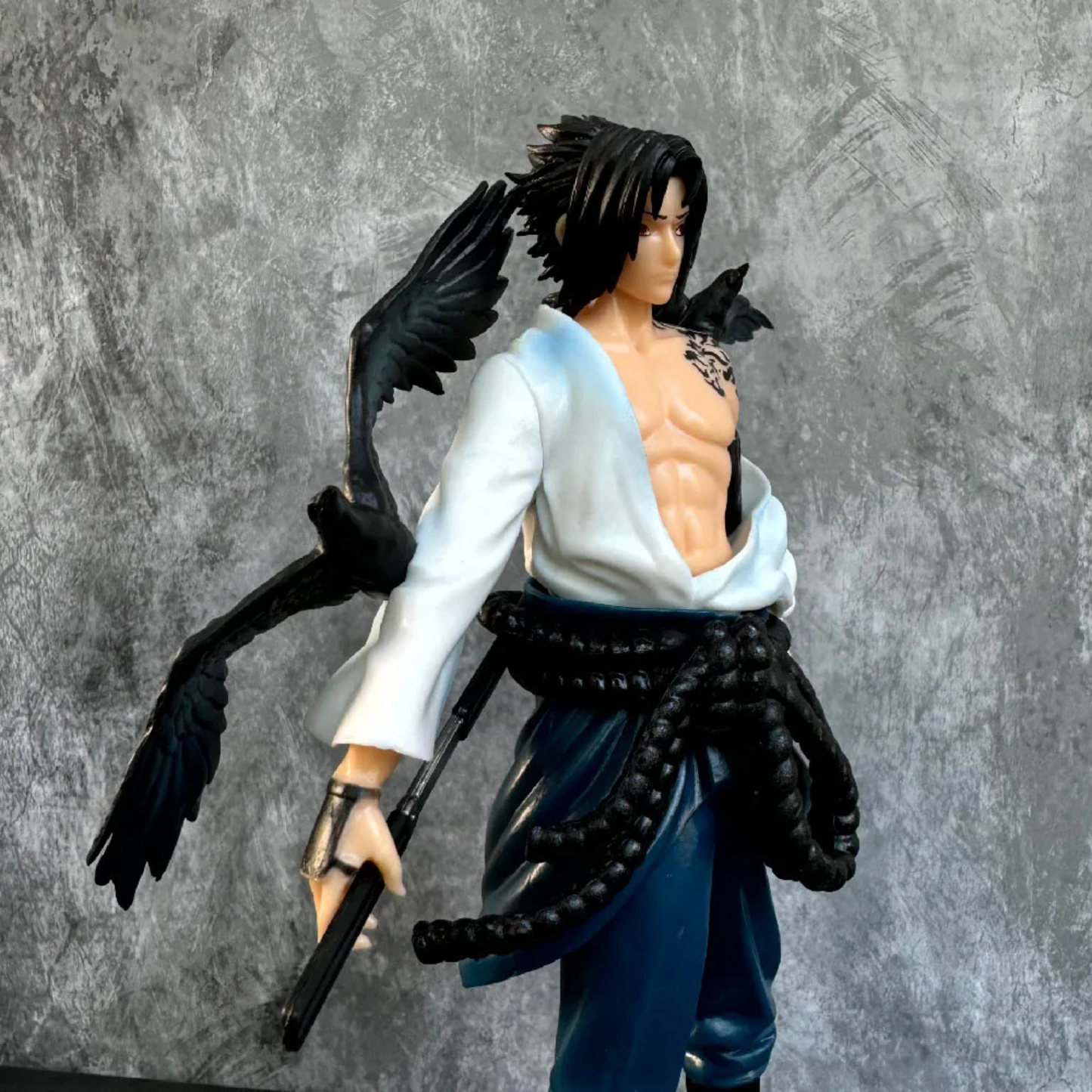 Sasuke Uchiha 30 cm action figure in Shippuden outfit with sword and intense gaze