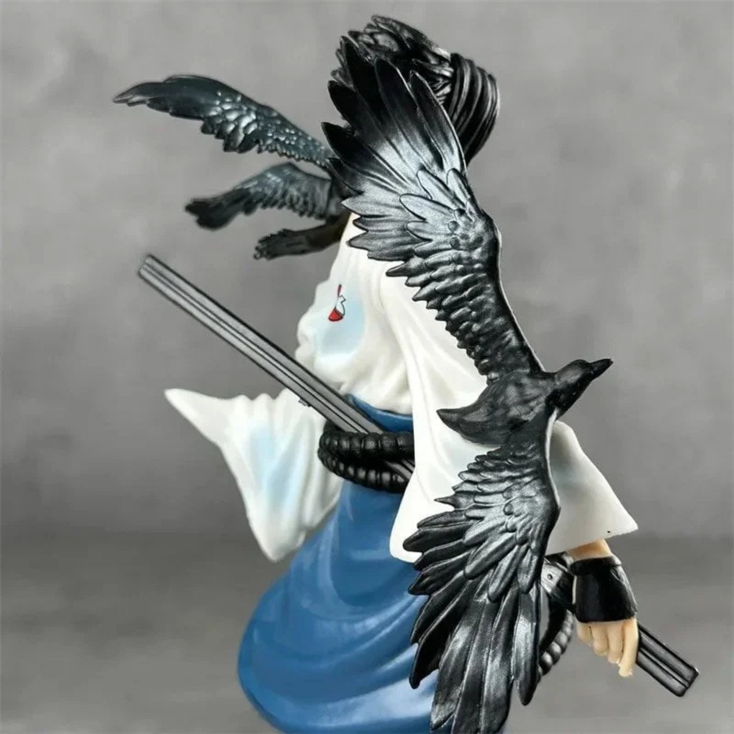 Sasuke Uchiha 30 cm action figure in Shippuden outfit with sword and intense gaze