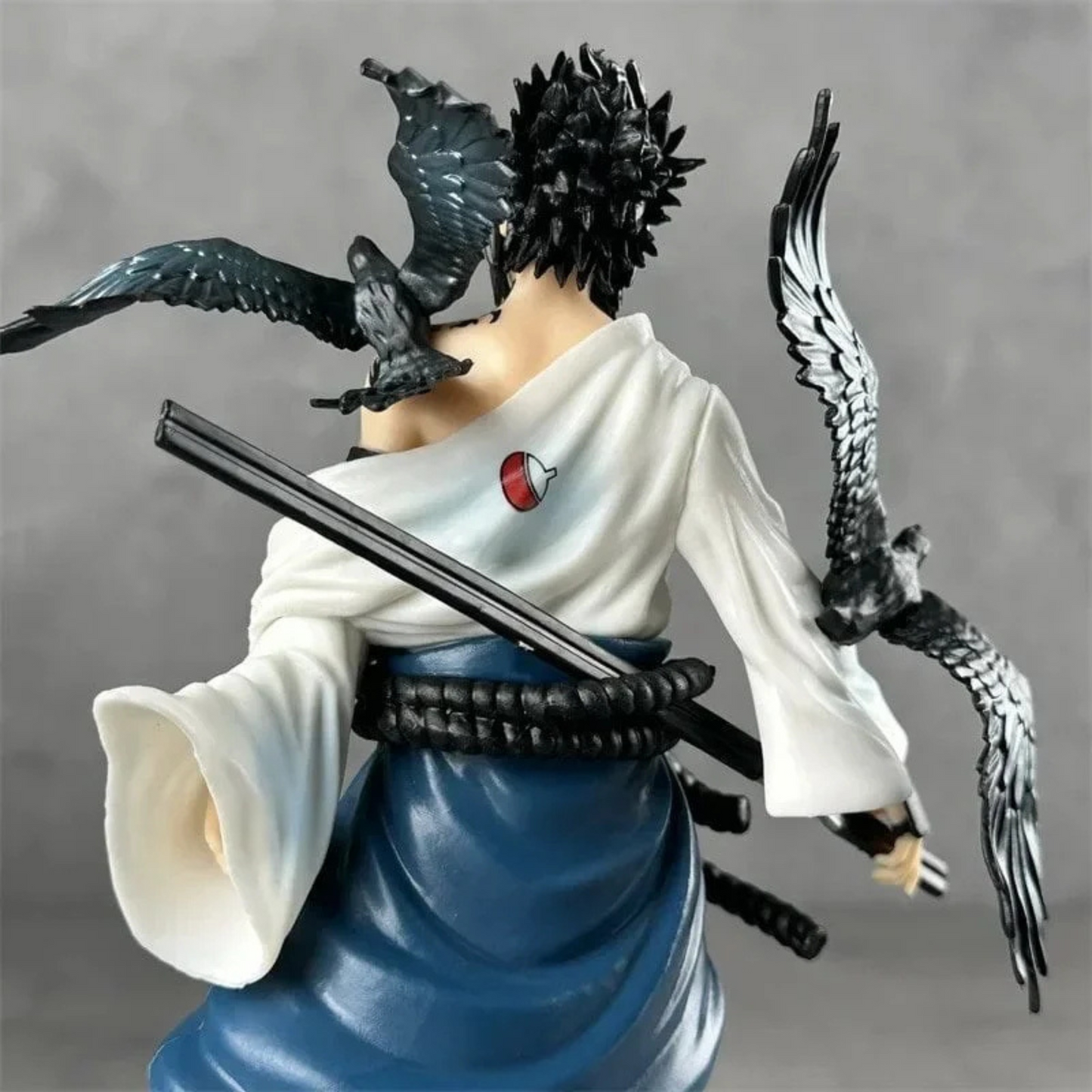 Sasuke Uchiha 30 cm action figure in Shippuden outfit with sword and intense gaze