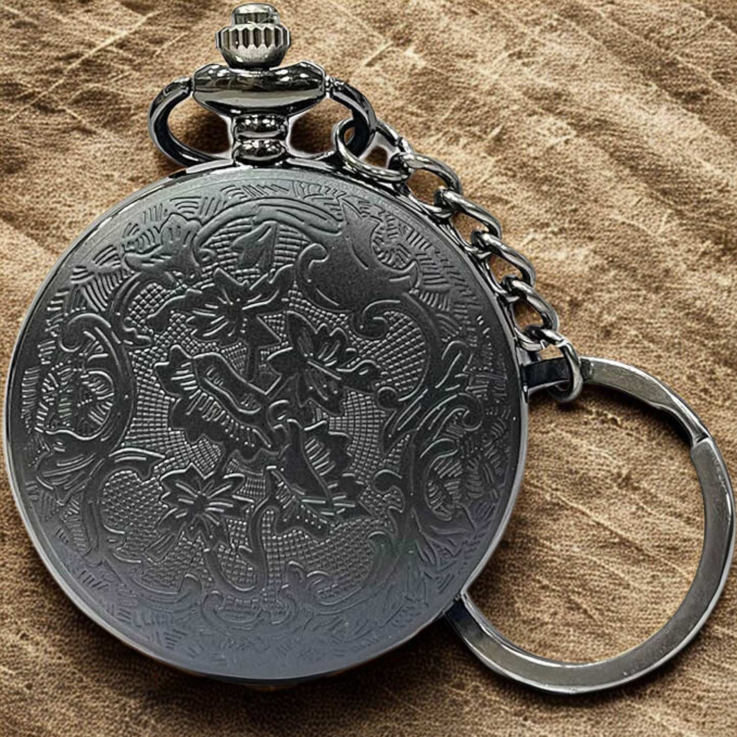 Close-up of engraved Demon Slayer pocket watch with bold numerals