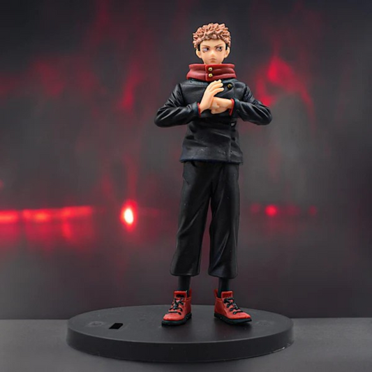 Jujutsu Kaisen Itadori Yuji action figure in school uniform with red hoodie, standing on a display base against a red-dark background