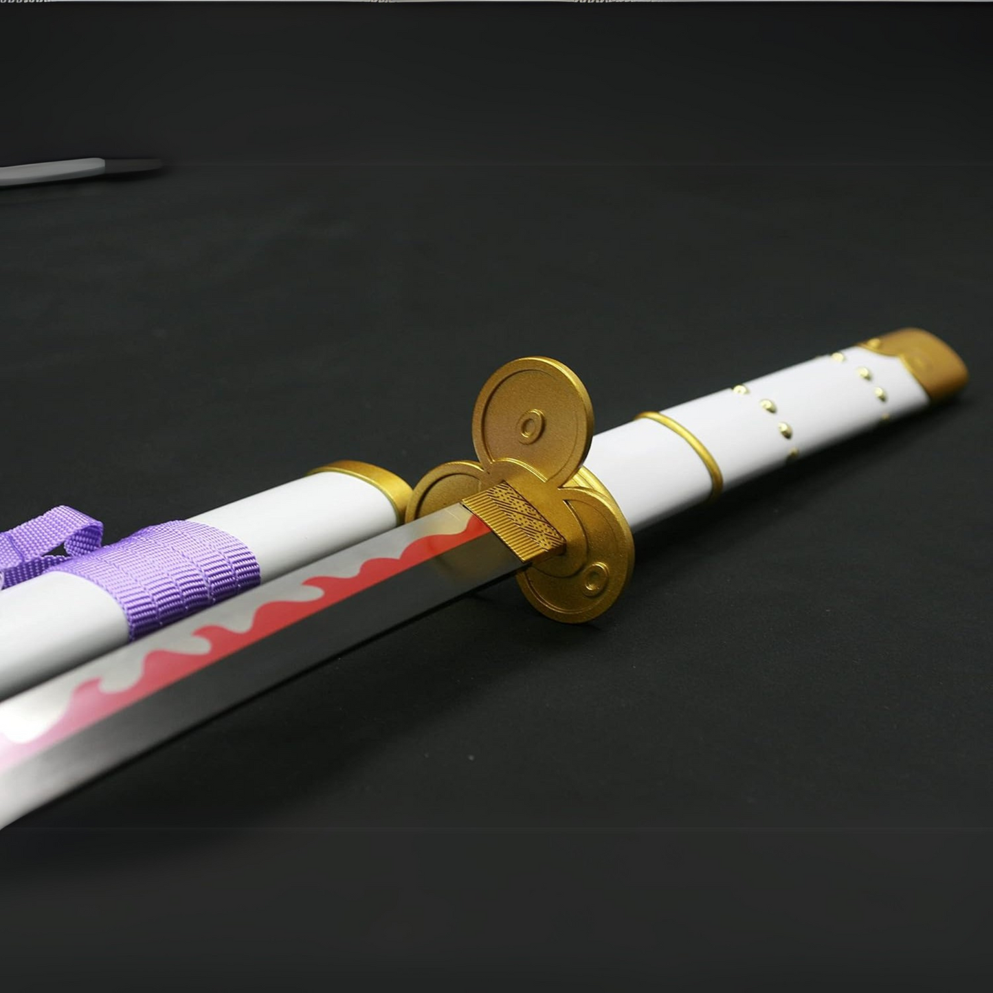 Zoro’s white Enma wooden katana displayed with white and gold hilt