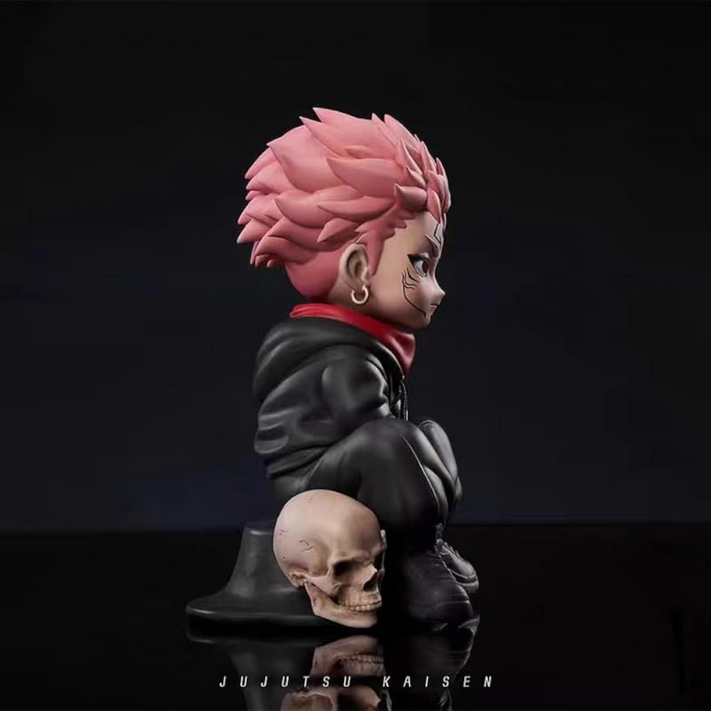 Chibi-style Ryomen Sukuna 12 cm action figure sitting on a skull base – Jujutsu Kaisen anime collectible