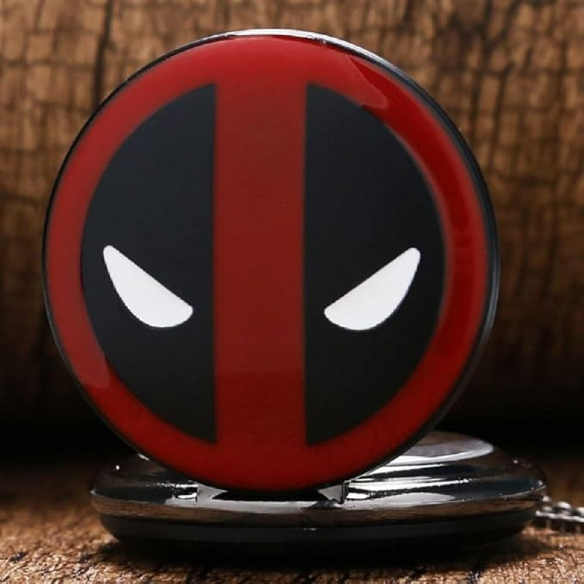 Close-up of Deadpool-themed pocket watch with retro dial and bold numerals
